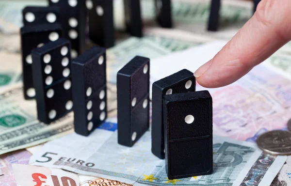 stock image Standing dominoes on bank notes