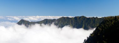 Fog forms on Kalalau valley Kauai clipart