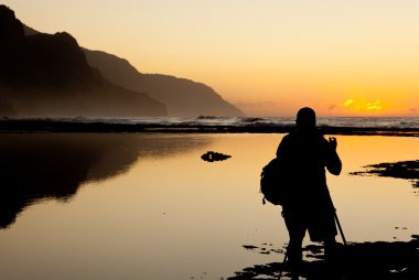 Misty sunset on Na Pali coastline clipart