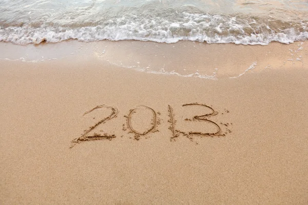 2013 written in sand with waves — Stock Photo, Image