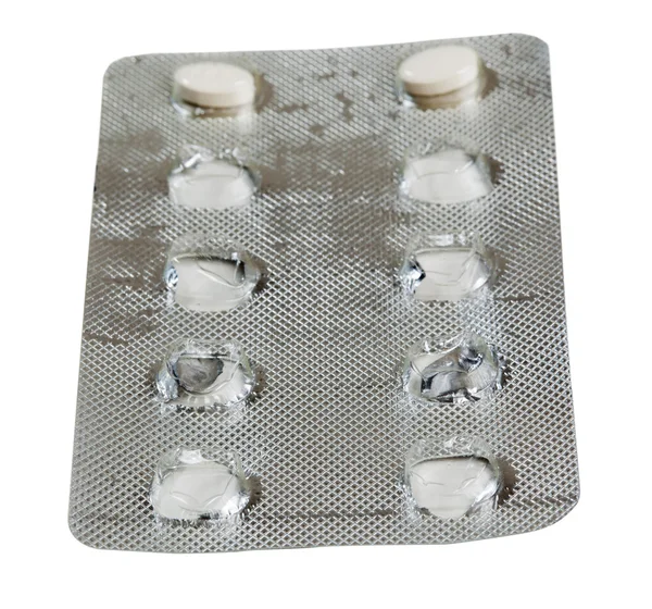 Foil packet for tablets with two white tablets — Stock Photo, Image