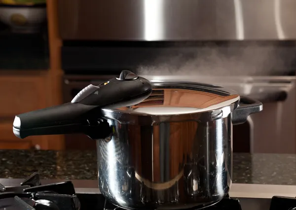 Steam escaping from new pressure cooker pot — Stock Photo, Image