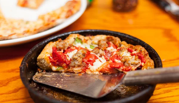 stock image Deep dish pizza in metal serving dish