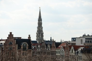 Brussels City Hall tower over buildings clipart