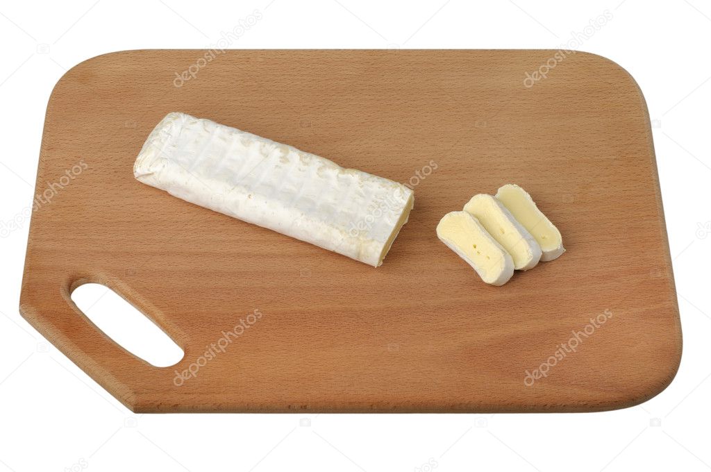 Sliced brie cheese on a wooden cutting board