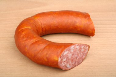 Smoked sausage in natural casing clipart