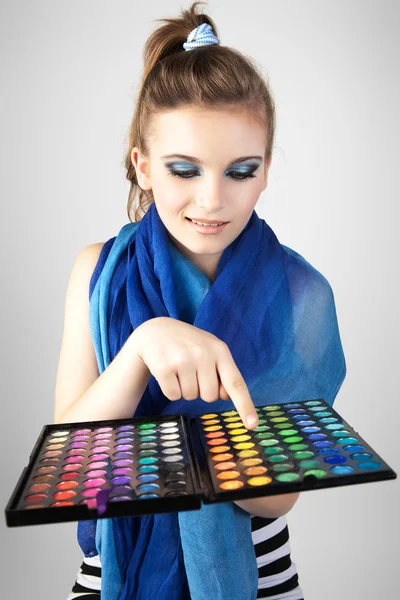 Portrait of beautiful woman with makeup palette. — Stock Photo, Image
