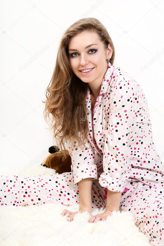 Picture of a morning sweet young girl in pink pajamas.
