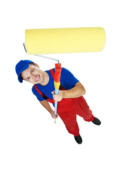 Painter man in uniform with paint roller — Stock Photo, Image