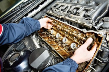 Machanic repairman at automobile car engine repair clipart