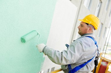 Builder facade painter at work clipart