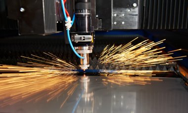 Laser cutting of metal sheet with sparks clipart