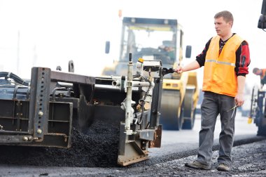 Worker at asphalting works clipart