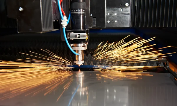 Laser cutting of metal sheet with sparks — Stock Photo, Image