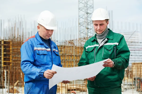 Engineers builders at construction site — Stock Fotó