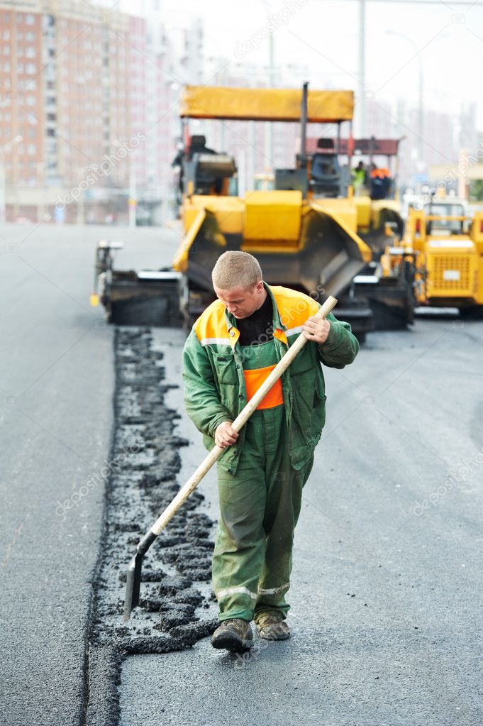 Worker at asphalting works