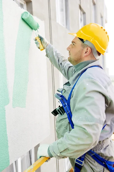 Constructor fachada pintor en el trabajo — Foto de Stock