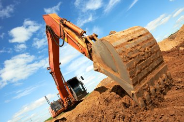 Track-type loader excavator at work clipart