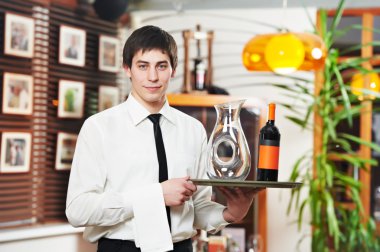 Waiter in uniform at restaurant clipart