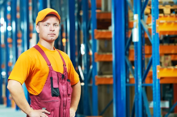 Caucasian young manual worker in warehouse — Stock Photo, Image
