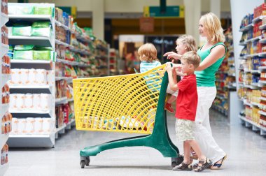 Woman and children making shopping clipart