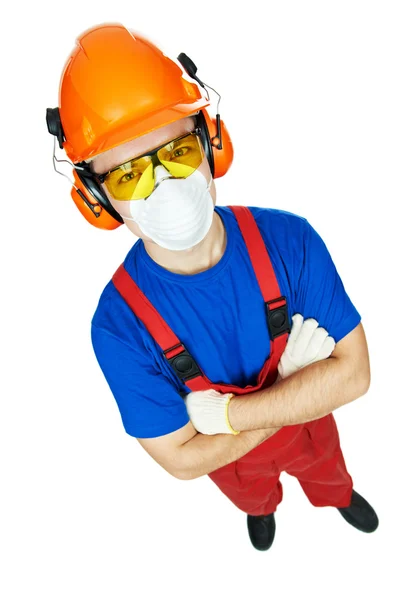 Construtor em hardhat, auriculares, óculos e máscara de gás — Fotografia de Stock