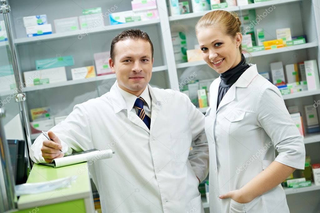 Pharmacy chemist team women and man in drugstore