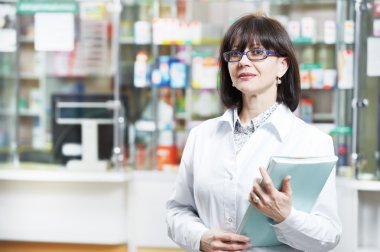 Pharmacy chemist woman in drugstore clipart