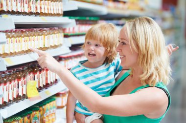 Woman and boy making shopping clipart