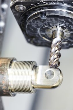 Close-up process of metal machining by milling clipart