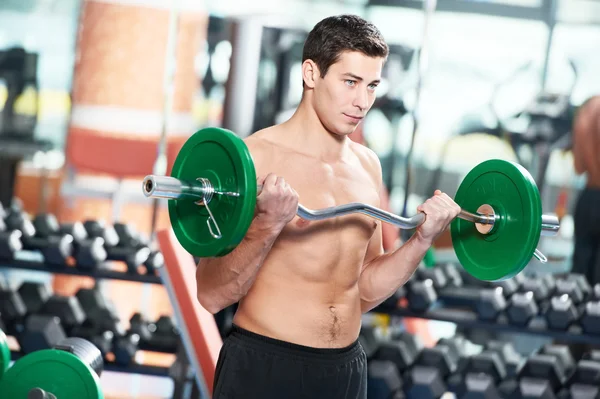 stock image Bodybuilder man doing biceps muscle exercises