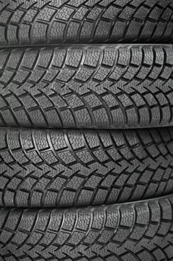 Background of four car wheel winter tires clipart