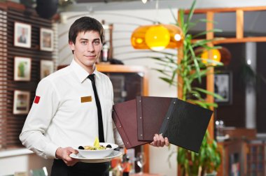 Waiter in uniform at restaurant clipart