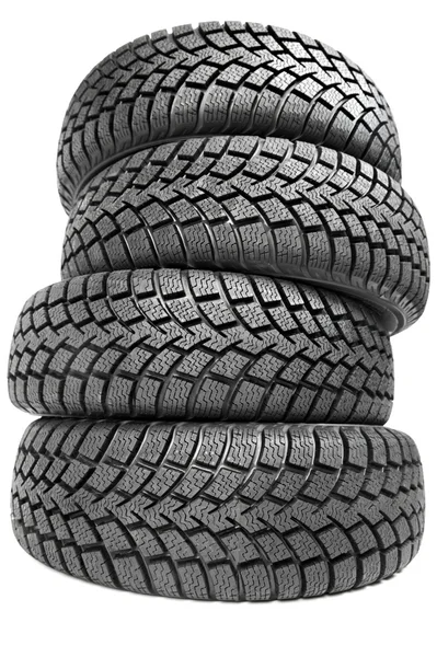 Stack of four car wheel winter tires isolated — Stok fotoğraf