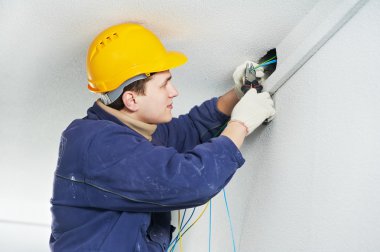 Electrician at cable wiring work clipart