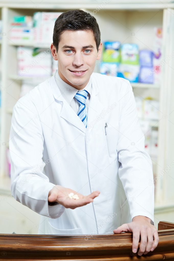 Handsome Pharmacy chemist man in drugstore