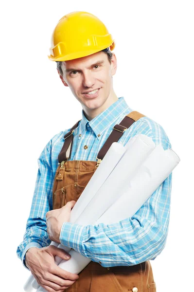 Счастливый работник в шляпе и в целом с драфтами — стоковое фото