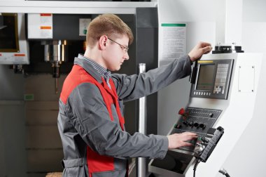 Laborer working with machine tool clipart