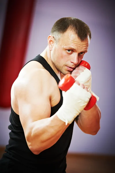 Boxer man at boxing training with dumbbells — Stock Photo, Image