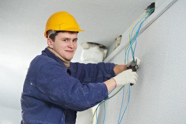 Electrician at cable wiring work clipart