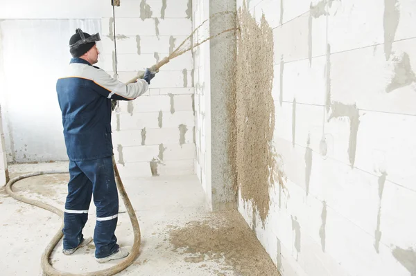 stock image Plasterer at stucco work with liquid plaster