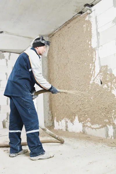 Plasterer at stucco work with liquid plaster — Stock Photo, Image