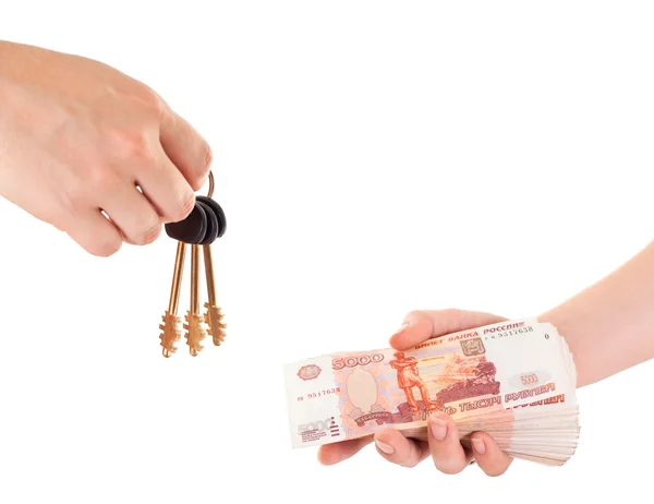 Huis sleutel in de hand en cash geld in andere hand geïsoleerd ob wit — Stockfoto