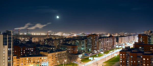 stock image Aerial view of night city with lights and moon