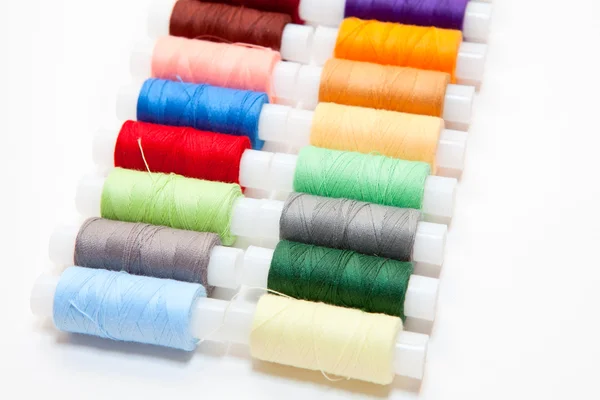 stock image Colourful arranged reel of thread