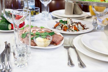 Russian rolled pancakes with red caviar in a plate on the table clipart