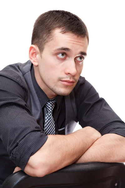 Portrait of young smart business man sitting on chair — Stock Photo, Image