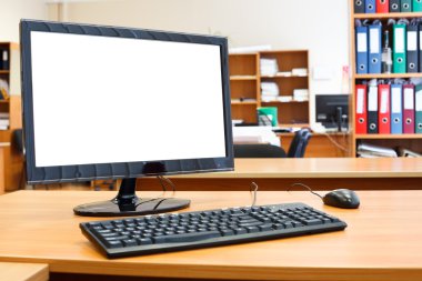 Modern personal computer on desktop in office room clipart