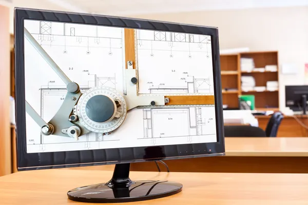 Computer monitor with blueprints and drawing board picture on desktop — Stock Photo, Image