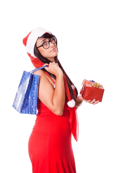 Kadın ile santa şapka ve Noel hediye — Stok fotoğraf